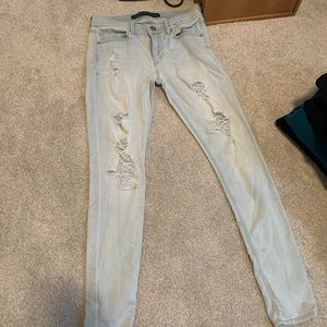 light wash low rise ripped skinny jeans